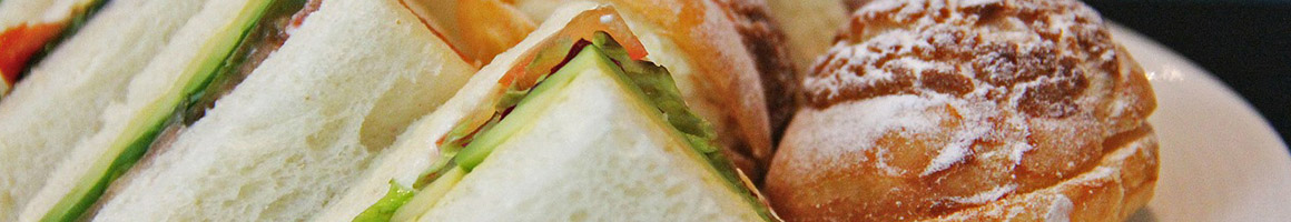 Eating Pizza Sandwich Seafood at Niko's Place Roast Beef & Seafood restaurant in Salisbury, MA.
